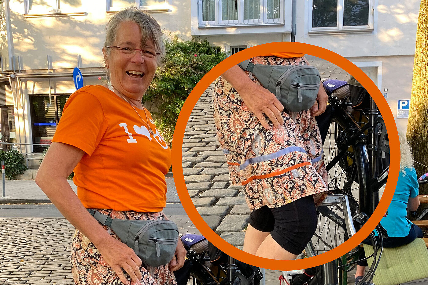 Angelika präsentiert ihren selbstgeschneiderten Rock im ADFC-Look Angelika im orangenen ADFC-T-Shirt mit dem Slogan "I love Fahrrad" präsentiert ihren selbstgeschneiderten Rock mit den ADFC-Streifen in orange und blau